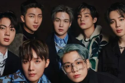 Grupo BTS en escenario durante concierto en Bogotá con fechas reprogramadas para octubre 2026