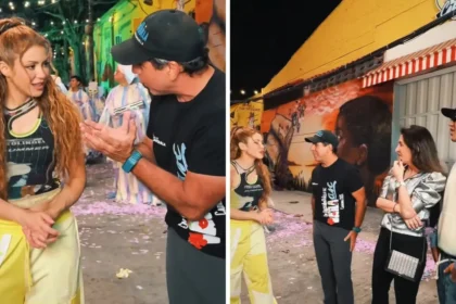 Shakira y Beéle filmando en el Barrio Abajo de Barranquilla, rodeados de comparsas y símbolos del Carnaval como marimondas y congos