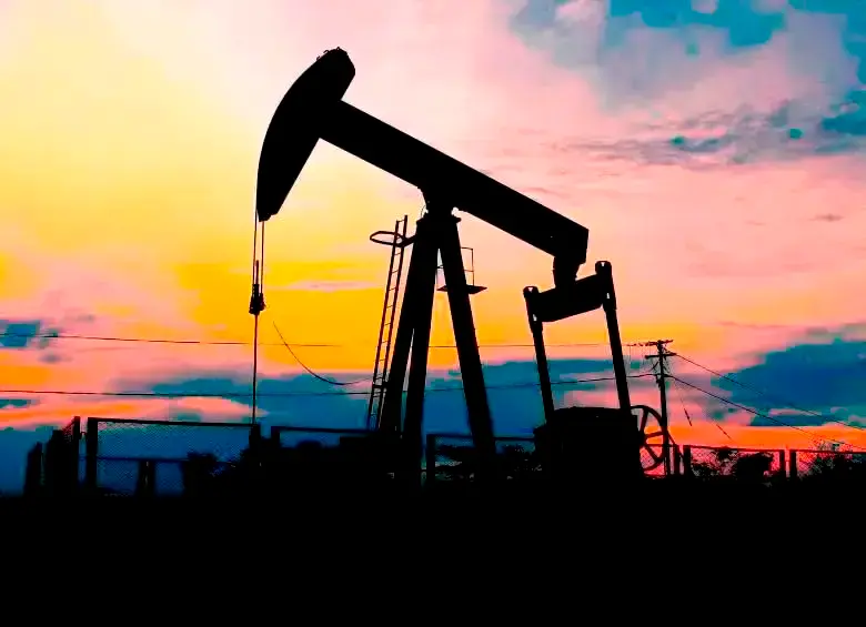 Gráfico del precio del petróleo Brent mostrando un alza del 9,38% tras bombardeos en Medio Oriente, con barriles y banderas de países productores