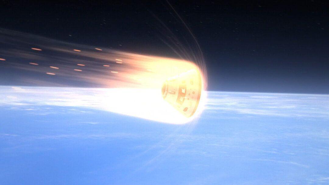 Cápsula Orión de Artemis II durante la reentrada a Tierra con escudo térmico al rojo vivo a 2700°C