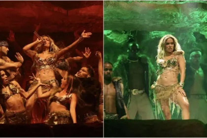 Karol G en el escenario de Coachella 2024 con atuendo de la bandera colombiana y mensaje 'No tengan miedo, sientan orgullo'