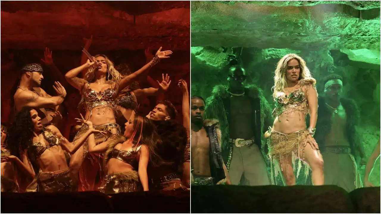 Karol G en el escenario de Coachella 2024 con atuendo de la bandera colombiana y mensaje 'No tengan miedo, sientan orgullo'
