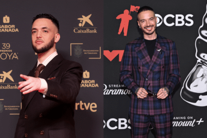 J Balvin en el escenario del Palacio de los Deportes de CDMX rindiendo homenaje a Milkman con una imagen proyectada del artista fallecido