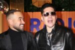 Chyno y Nacho en escenario anunciando el Radio Venezuela World Tour 2026-2027 con banderas de Latinoamérica